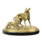 A GROUP OF BRASS DOGS ON PORCELAIN BASE