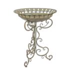 AN IRON BIRD BATH ON STAND