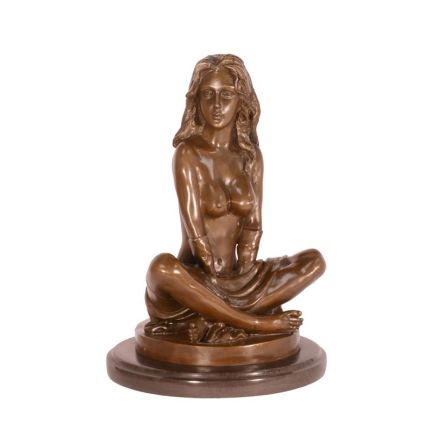 #A BRONZE SCULPTURE OF A SEATED NUDE