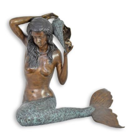 A BRONZE FOUNTAIN OF A MERMAID WITH A SHELL